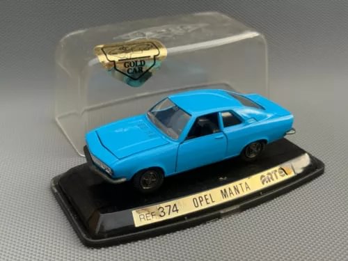 Blue diecast Opel Manta car model on black display base, front angle view