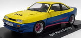 Yellow and blue 1:18 scale diecast model car with red wheel accents