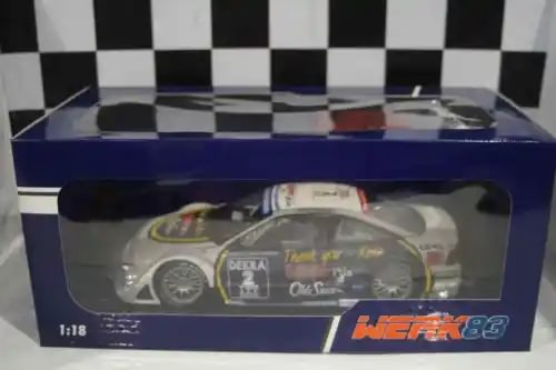 Diecast race car model in blue window box, gray body with racing decals