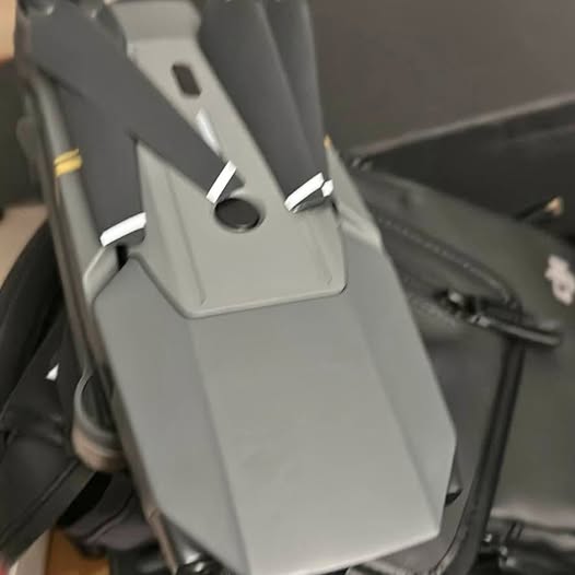 Gray drone module with port cutouts