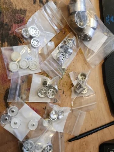 Model kit wheel and tire parts, silver metal wheels in clear bags