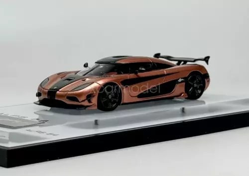 1:64 scale sports diecast car model, orange and black with rear wing