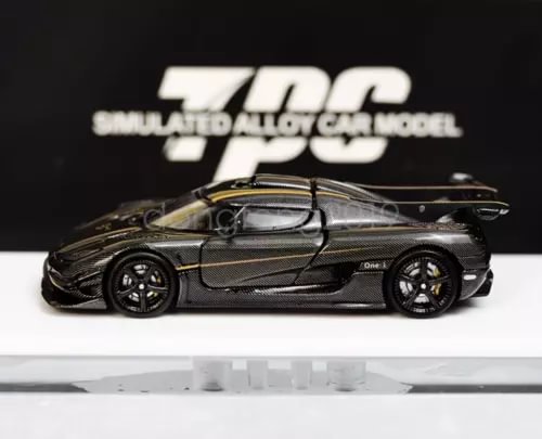 1:64 diecast metal sports car with dark body and gold accents, detailed wheels