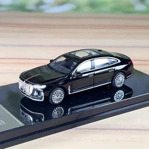 Black diecast sedan model car with silver grille and wheels