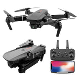 Quadcopter drone with dual camera and LED lights, plus handheld controller with screen