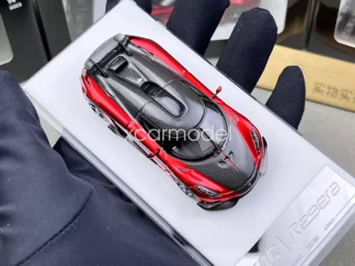 1:64 scale red and black diecast sports car with open details, carbon-look top