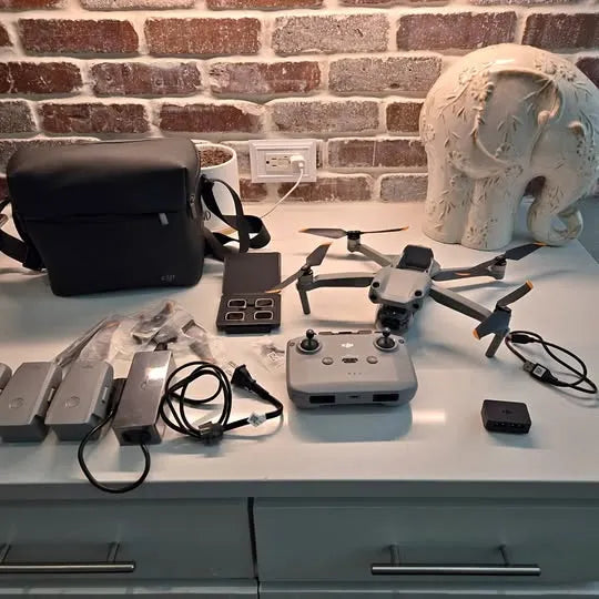 DJI Air 2S drone kit with controller, batteries, case, and cables