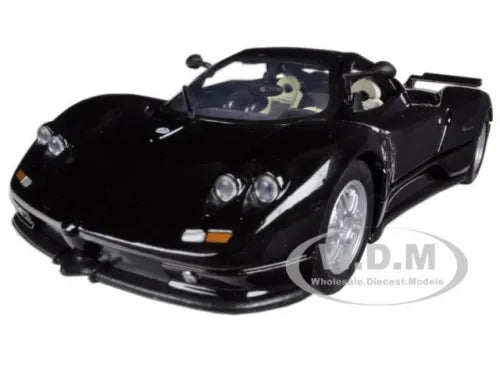 Black 1/24 diecast sports car model with front lights and chrome grille
