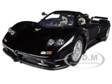 Black 1/24 diecast sports car model with front lights and chrome grille