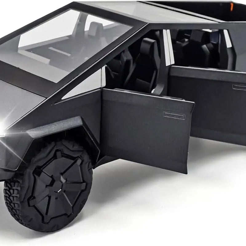 Black diecast metal toy truck with large tire and open door