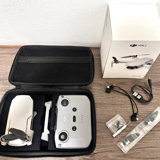 DJI Mini 2 drone with open travel case and accessories