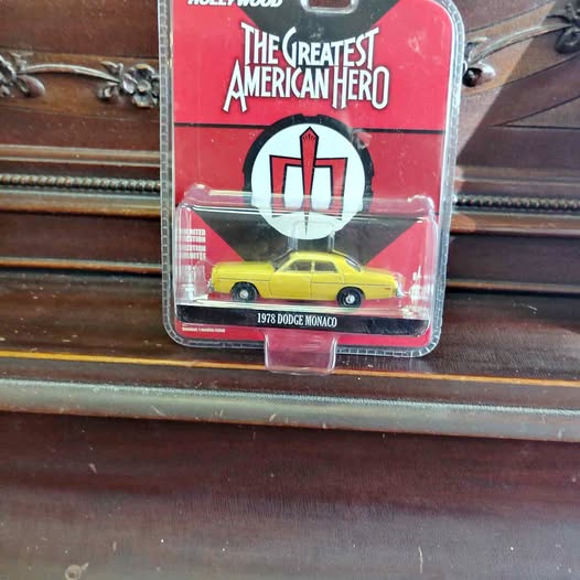 Yellow 1978 Dodge Monaco diecast model car in blister packaging