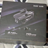 Retail box featuring a gray quadcopter drone with LED-style lights graphic