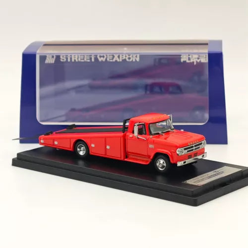 Red 1/64 diecast ramp truck model with open bed, in display base and case.