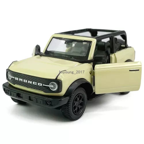 Beige open-top diecast pull-back model car with Ford Bronco front grille