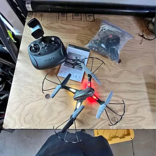 Blue-gray quadcopter drone with remote controller and propellers