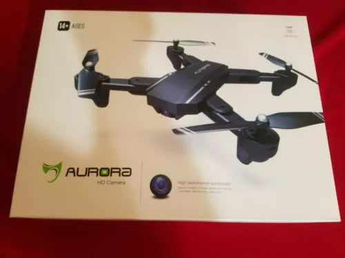 Foldable RC quadcopter drone with camera lens, shown on product box