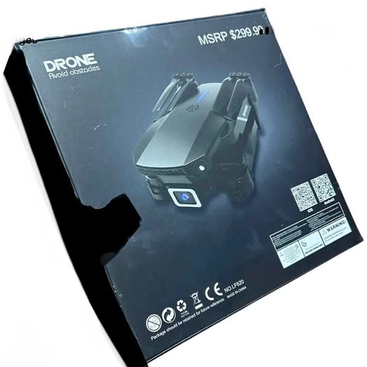 Adult 8K camera drone in retail box, black and gray, foldable quadcopter design
