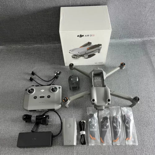 DJI Mavic Air 2S drone kit with controller, spare batteries, and charging cable