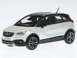 White metallic diecast SUV model car with black wheels, front three-quarter view