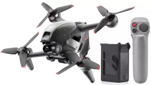 FPV drone with onboard camera, black body with four propellers, plus battery and controller