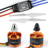 FPV quadcopter motor assembly with propellers, orange brushless motors and wiring