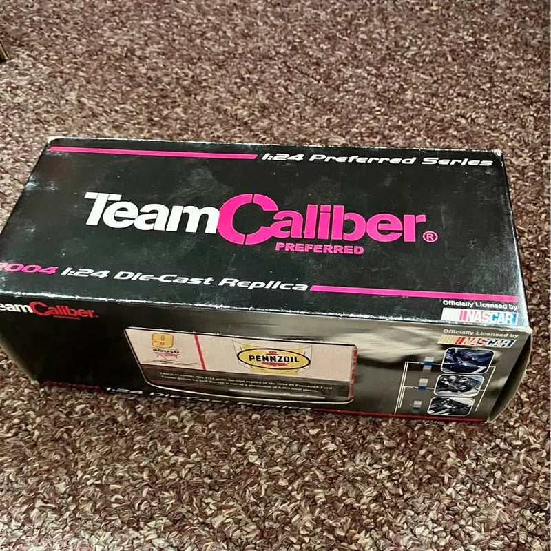 NASCAR 1:24 diecast toy in Team Caliber preferred series box, black with pink logo