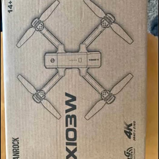 Drone box packaging with 4K camera graphic and propeller pattern