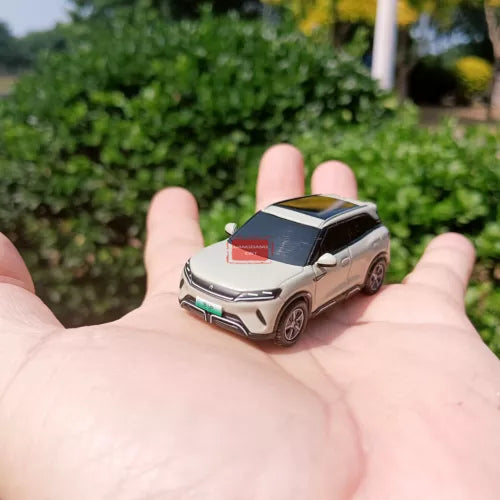 1/64 diecast model SUV car with beige body and black roof, front angled view