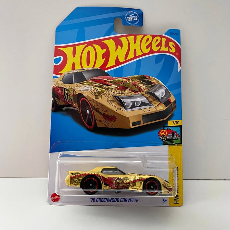 Hot Wheels diecast Corvette toy car in blister pack, tan and red art graphics.