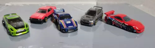 Loose diecast toy cars with mixed red, green, blue, and black bodies