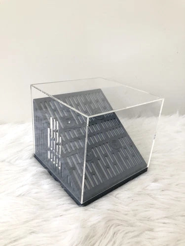 Clear display stand case with dark base and metal frame