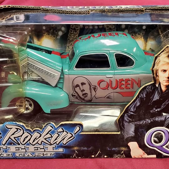Turquoise Queen-themed 1:24 diecast car model with bold graphic decals and chrome details
