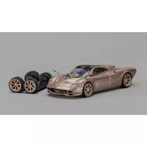 1/64 gold diecast mini sports car with black wheels and front grille detail