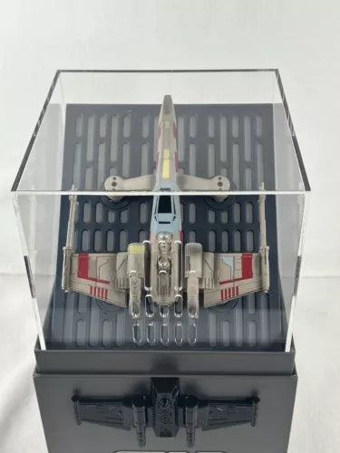 X-wing battle drone quadcopter in clear display case, front view