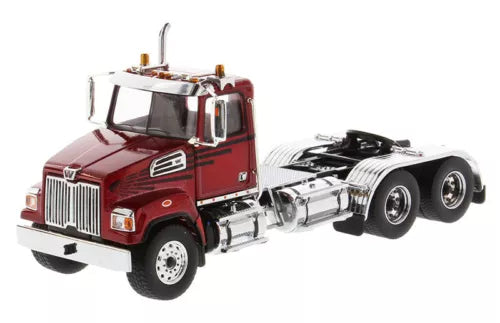 Red diecast day cab tractor model with chrome grille and chrome fuel tank, front view