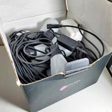 Drone kit in box with bundled cables and power adapter