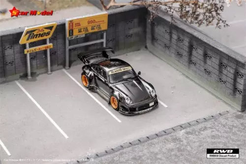 Diecast model car, black and silver GT race car, 1:64 scale.