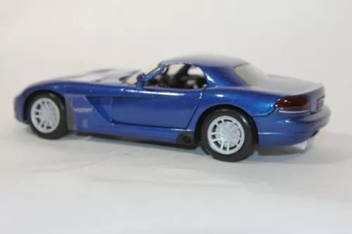 Blue diecast sports car model with open hood detail, 1/24 scale