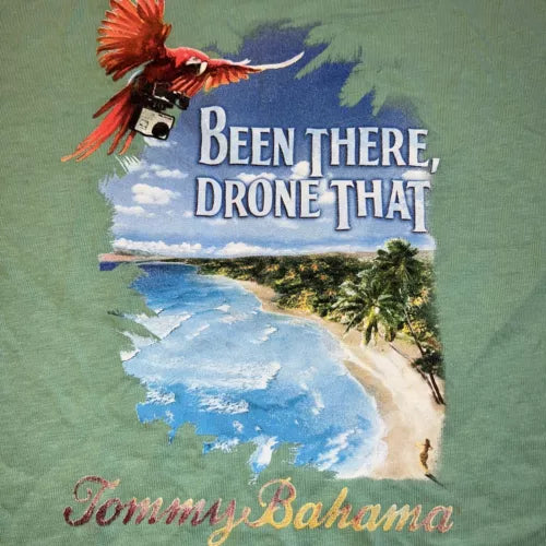 Green Tommy Bahama beach T-shirt with parrot and drone graphic, “BEEN THERE, DRONE THAT”