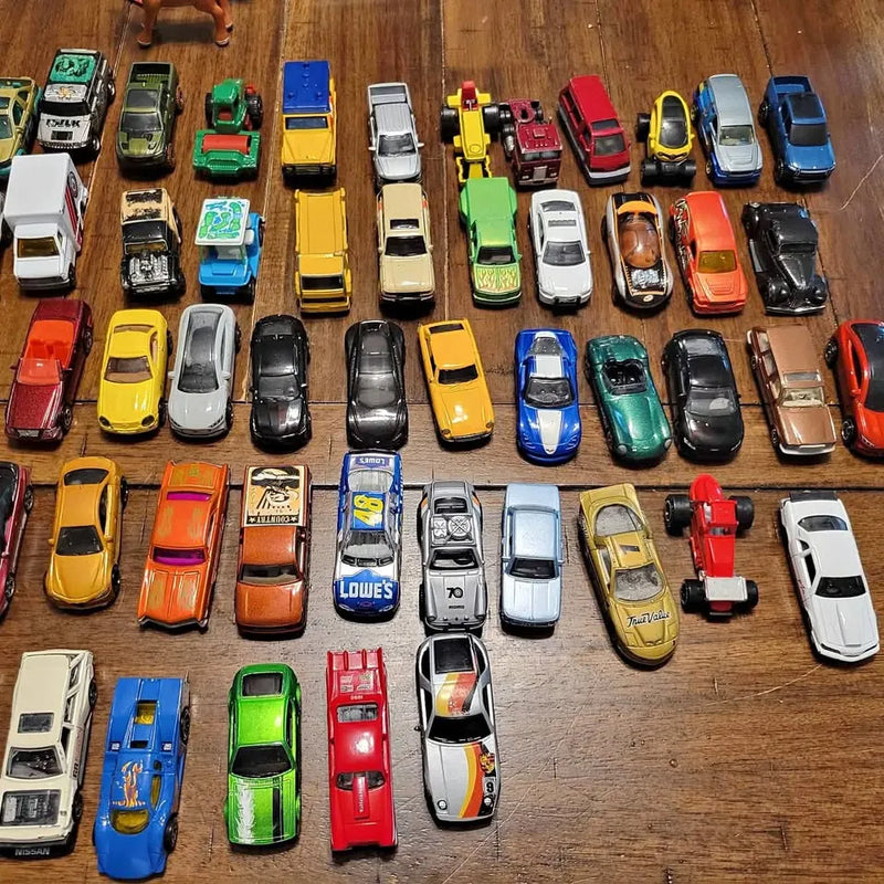 Assorted diecast toy cars, mixed colors and styles on display