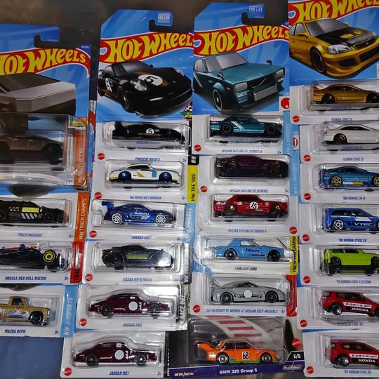 Blister-pack diecast car sets with multiple Hot Wheels style model cars