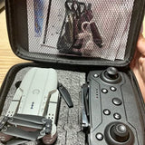 Obstacle avoidance drone and remote controller in a zip case, gray and dark