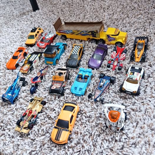 Hot Wheels diecast car assortment with multiple colorful toy cars in different designs