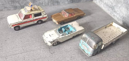 Vintage diecast police vehicle bundle, four cars in red, brown, white, and blue.