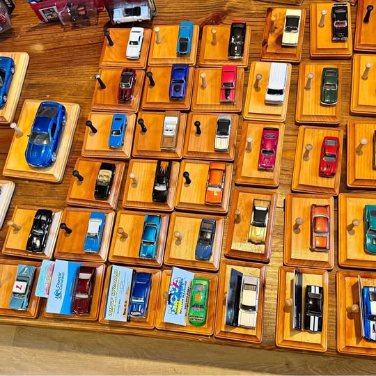 Assorted diecast race cars on individual display cards, mixed colors