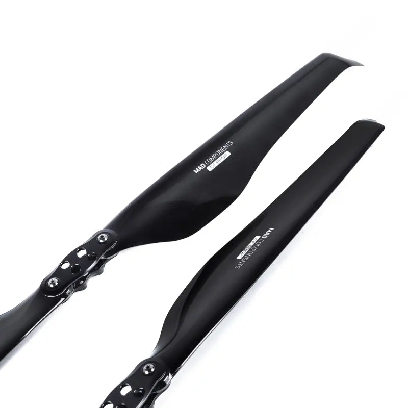 Black carbon fiber folding propeller blade pair with mounting holes and screws