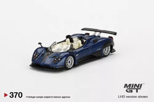 Blue open-top metal diecast model car, MINI GT 1/64, front 3/4 view