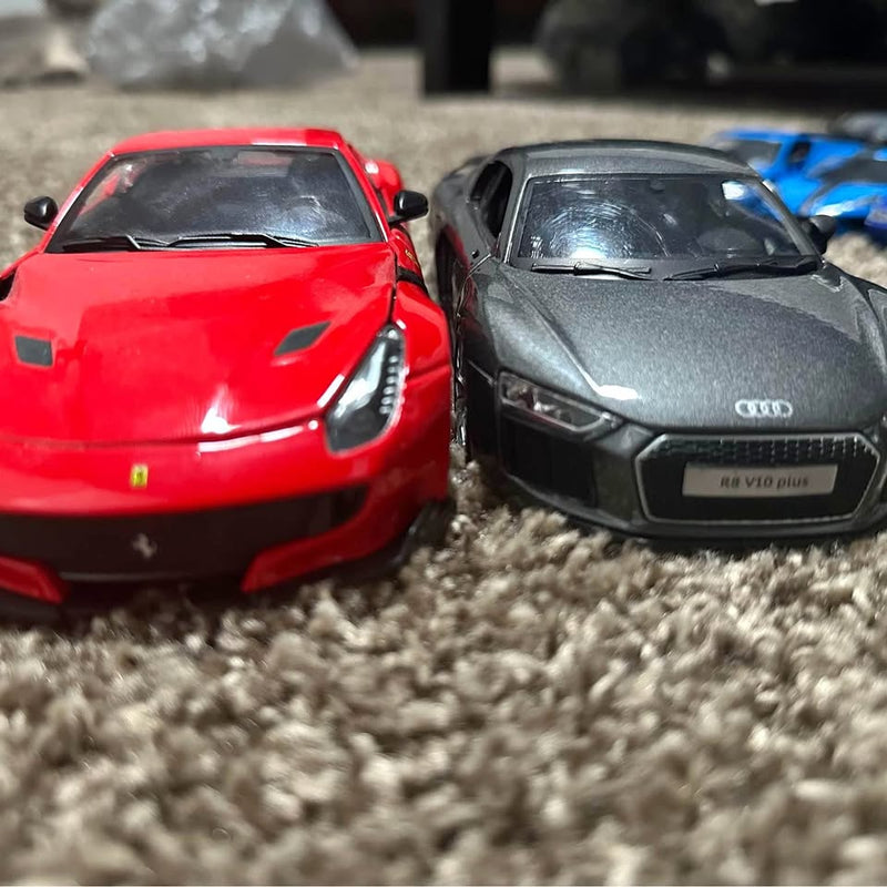 Diecast sports cars, red and gray, front view, detailed grilles and headlights