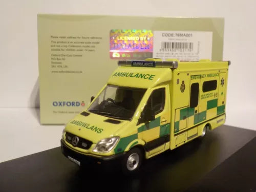 Yellow emergency ambulance diecast model with green checker panel and Oxford branding